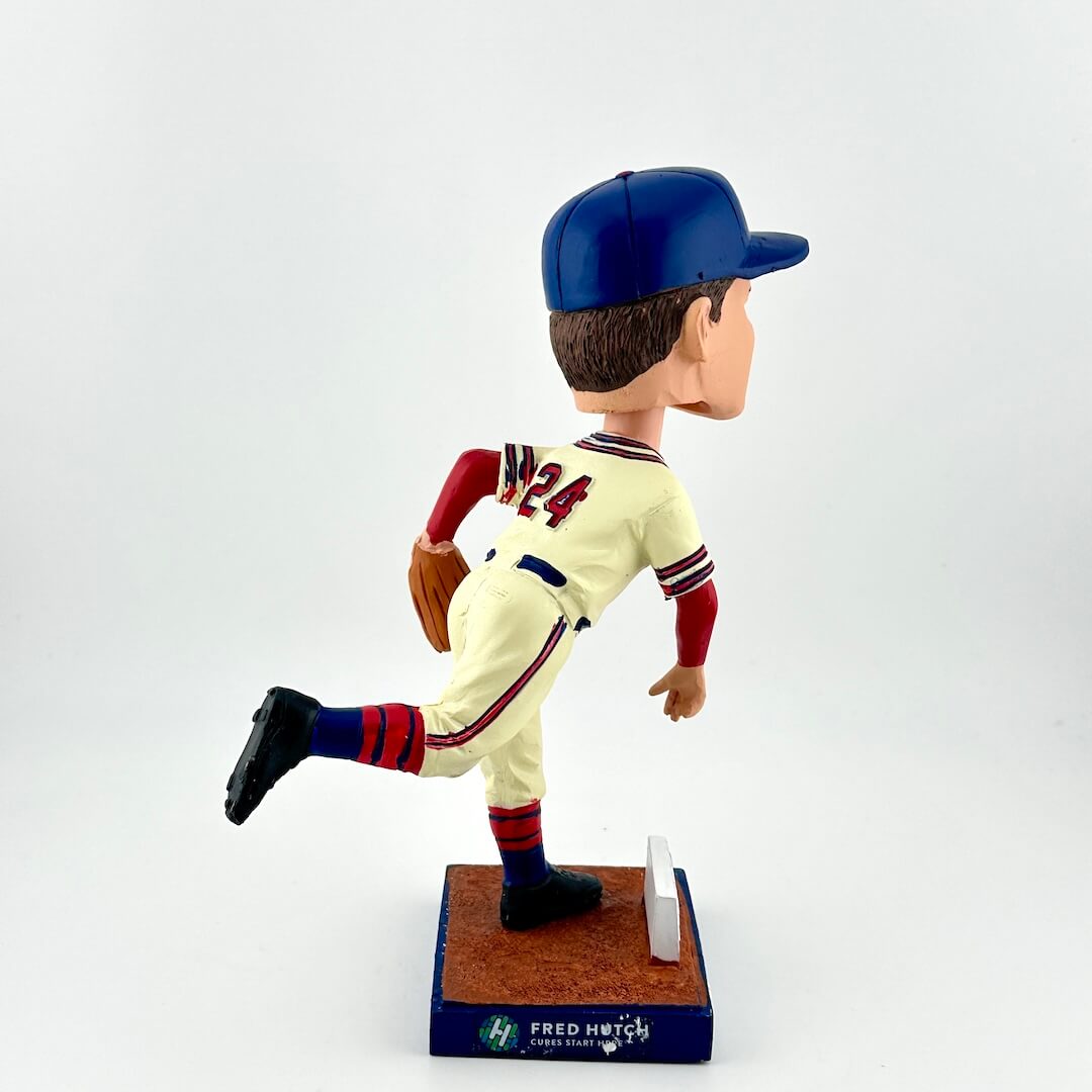 Baseball bobblehead figure in a vintage uniform on a white background