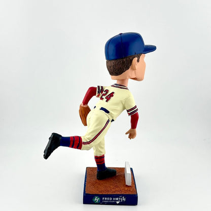 Baseball bobblehead figure in a vintage uniform on a white background