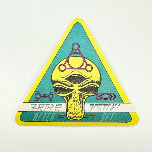 Triangular fabric backstage pass with alien face as central image and text "Furthur Festival"