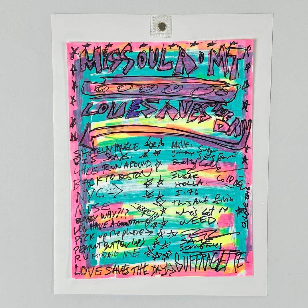 A setlist featuring a colorful graffiti-style design with the text 'MISSOULA' and 'LOVE SAVES THE DAY'