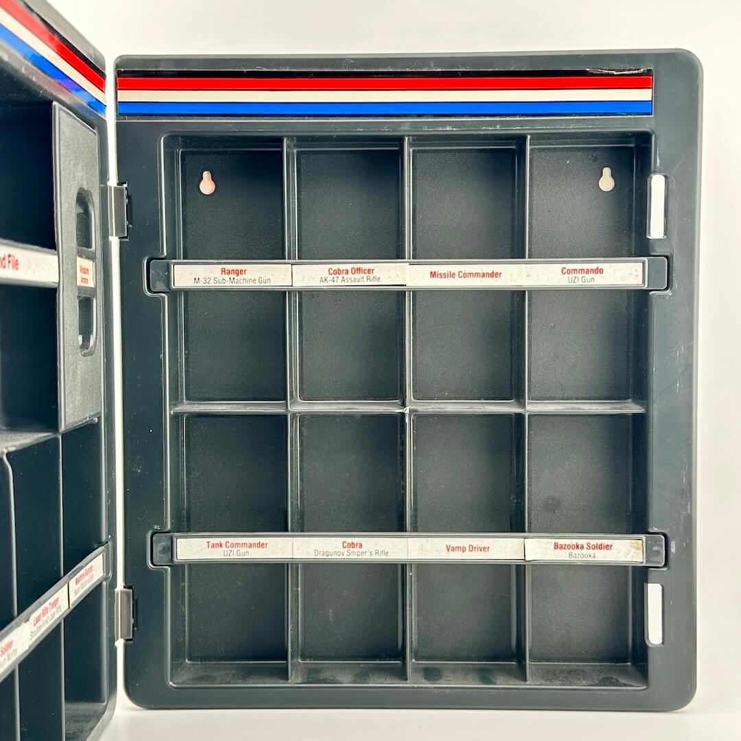 GI Joe toy box with compartments labeled for various figures and accessories.