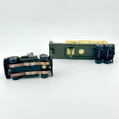 Underside of slot car to show electric components.