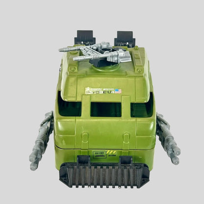 Green toy tank with America branding on gray background. 