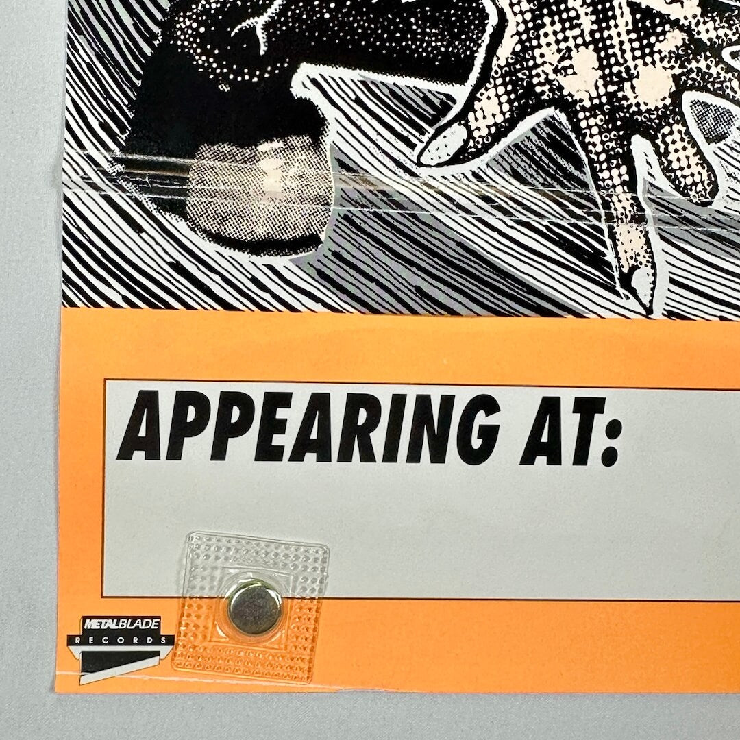 Bottom left corner of poster with crease to corner and another crease visible further up. 