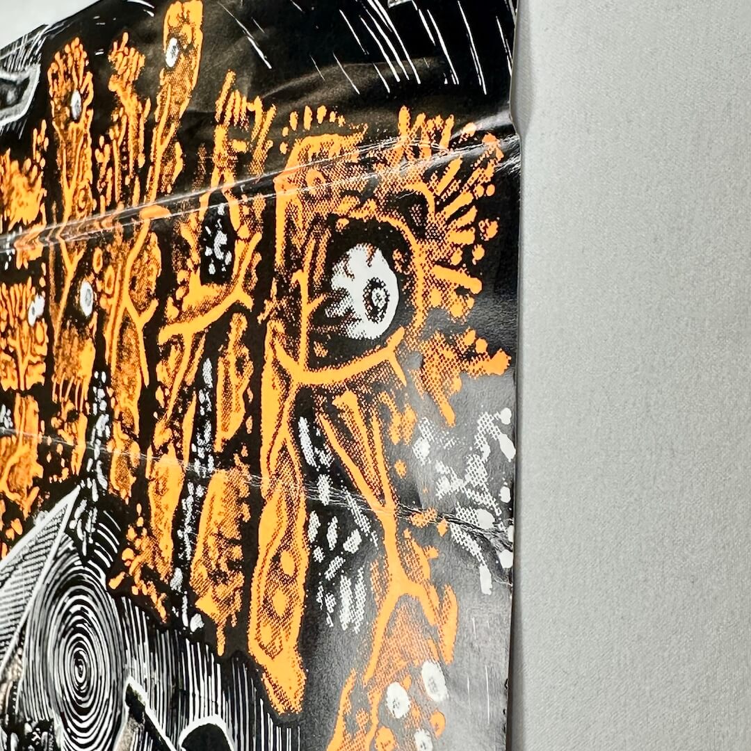 Side view of poster to show creases. 