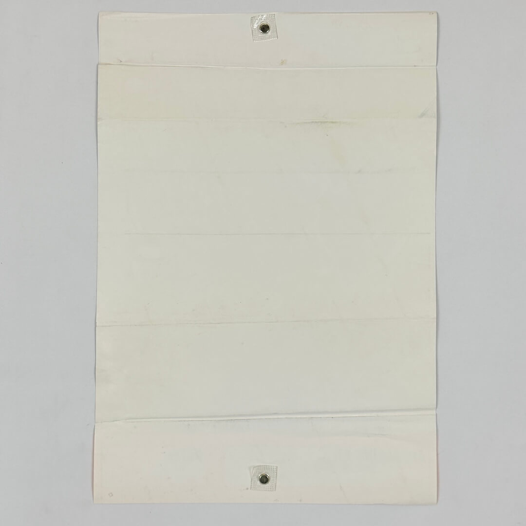 Backside of white poster against white background. 
