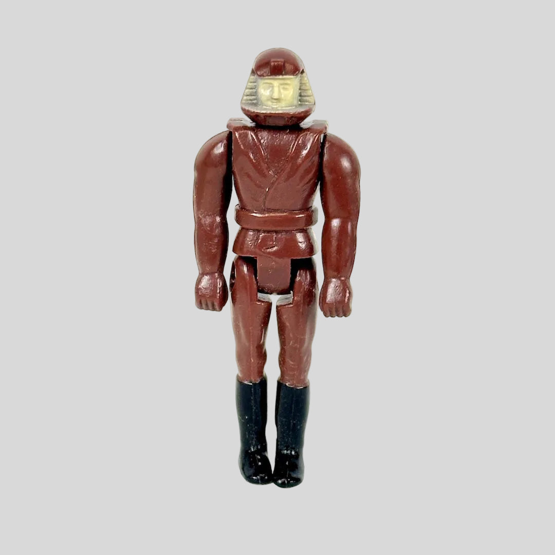 A vintage pilot figure in all maroon flight-suit with helmet, and black boots.