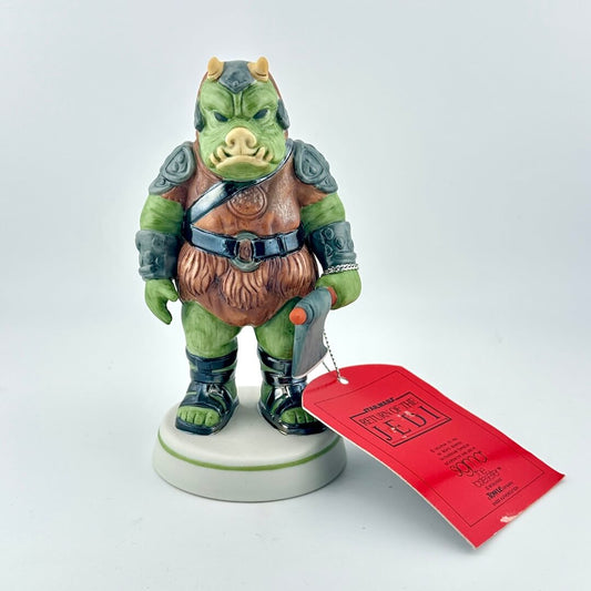 Gamorrean Guard figurine with red tag against white background. 