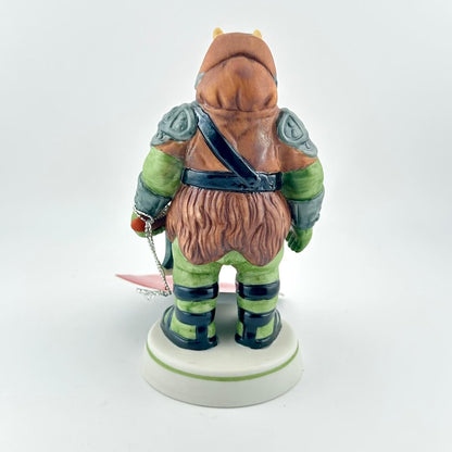 Gamorrean Guard figurine with red tag against white background. 