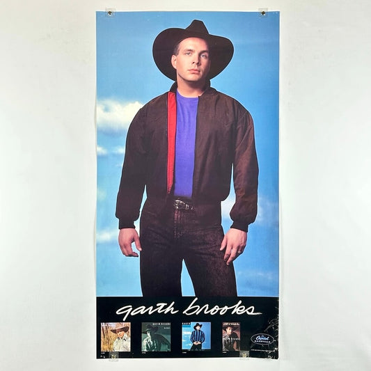 Poster of a person wearing a cowboy hat and jacket with 'GARTH BROOKS' branding.