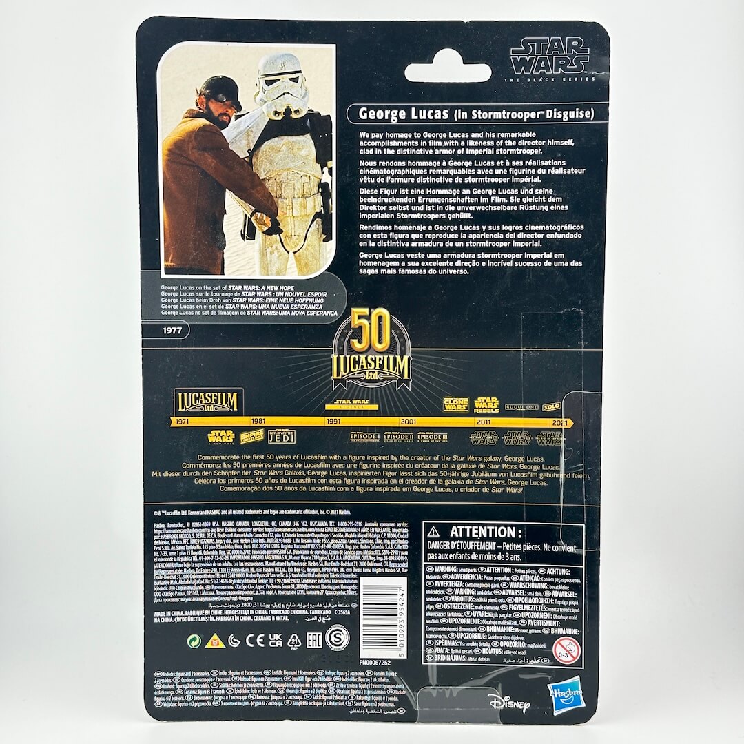 Back of Star Wars action figure packaging with product information, warning labels, and logos.