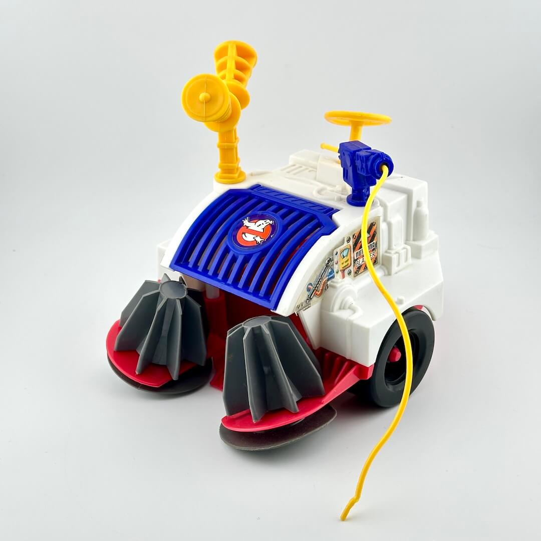 Toy vehicle with a blue top and red and black bottom on a gray background