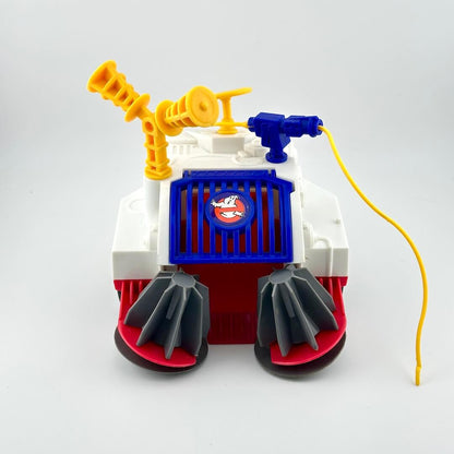 Toy robot with a red base, gray legs, and colorful top on a white background