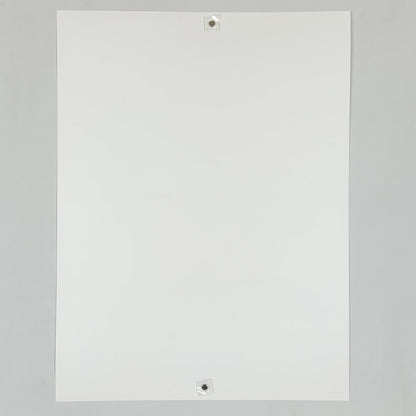 Backside of white poster against white background. 