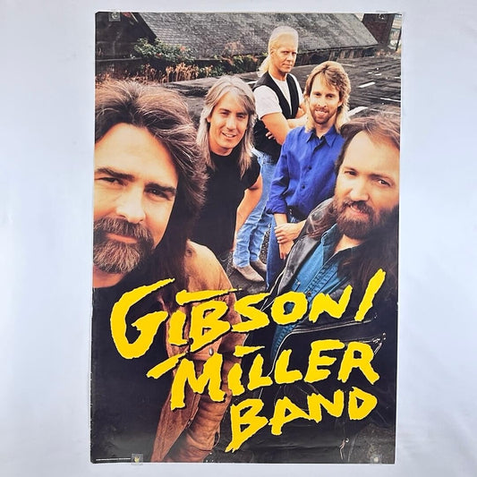 Poster of the Gibson Miller Band with four band members and the band name in yellow text.