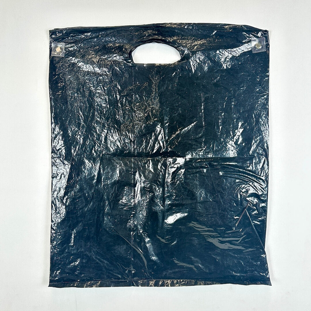 Black plastic bag with a handle on a white background