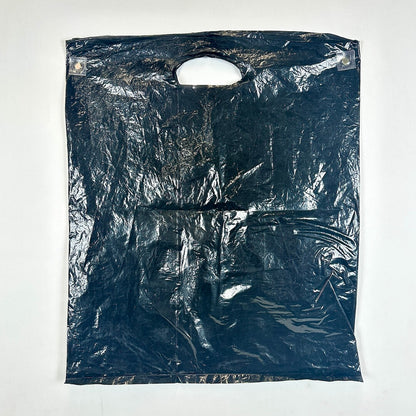 Black plastic bag with a handle on a white background