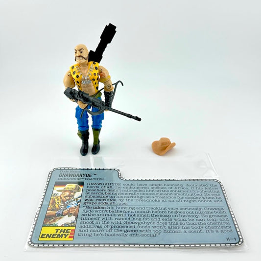 Toy figure with a weapon and a card on a white background