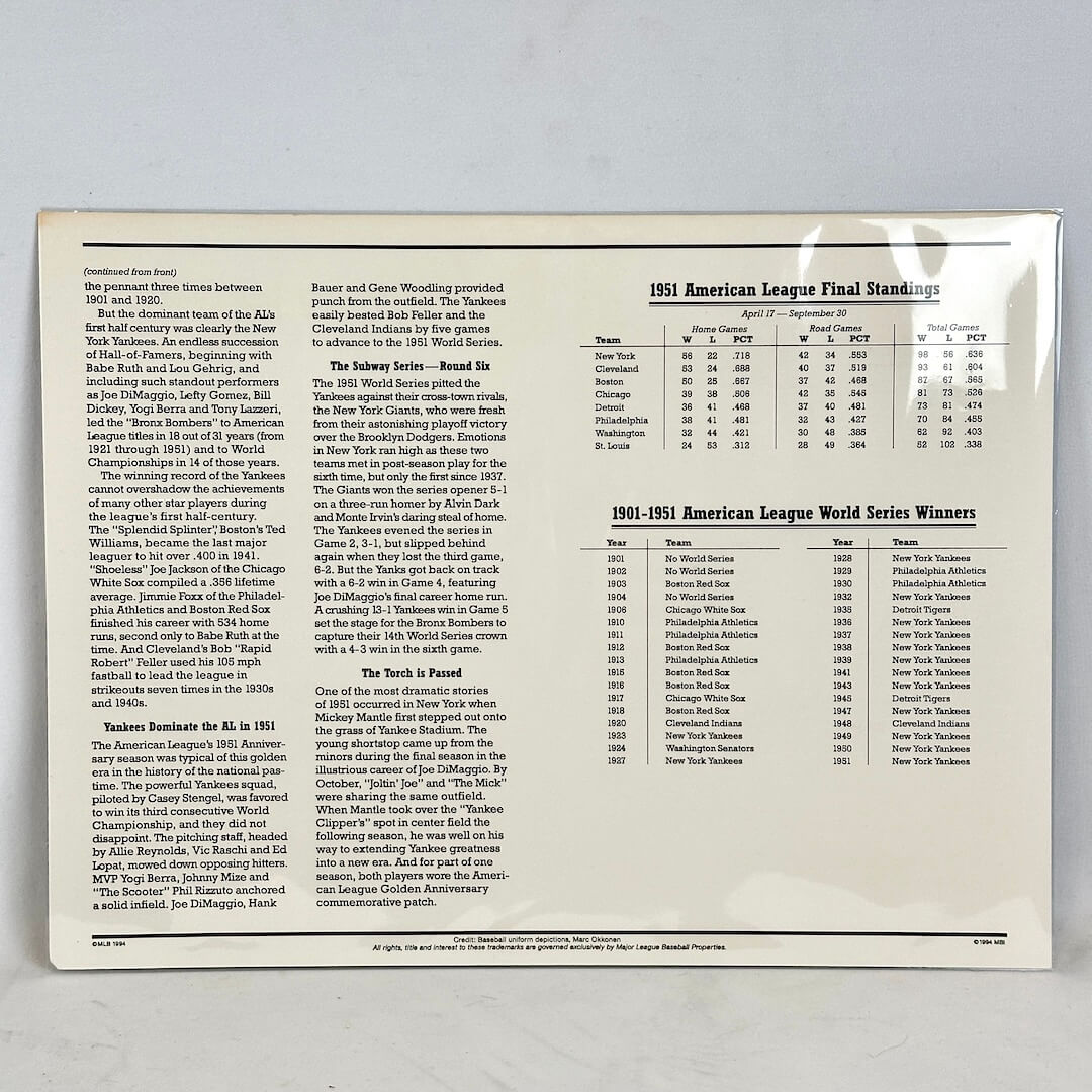 Printed document with text and tables on a gray background