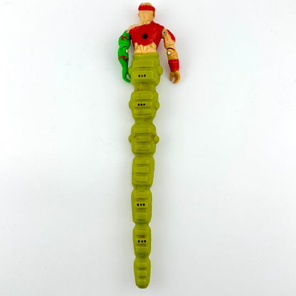 Toy figure with a green body and red top on a white background