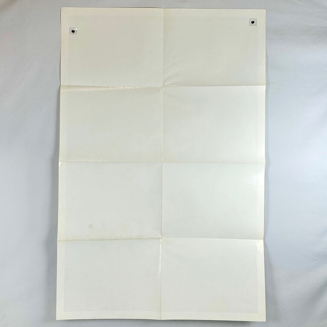 White paper with folds on a light gray background
