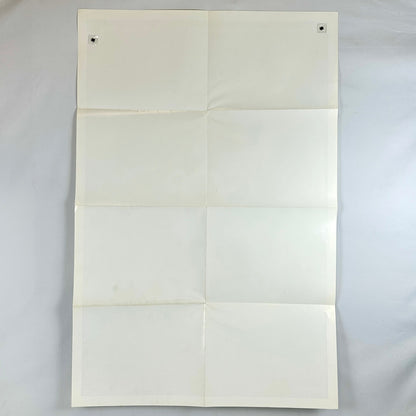White paper with folds on a light gray background