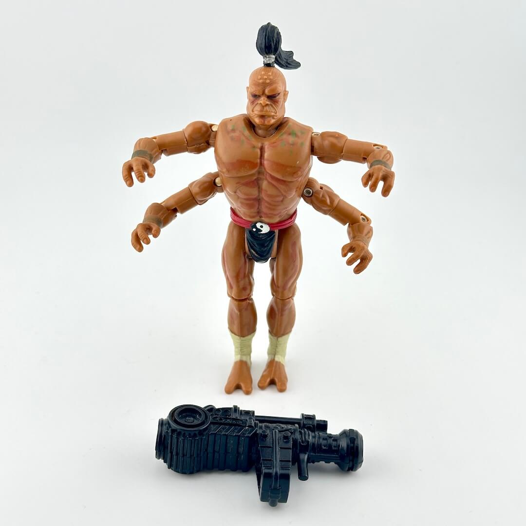 GI Joe/Mortal Kombat action figure with four arms and ponytail, in loincloth, pictured with accessory.