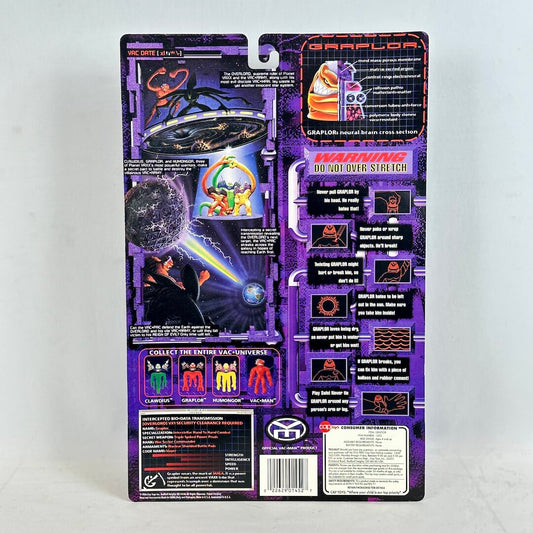 Vintage toy figure packaging with purple and black design on a white background