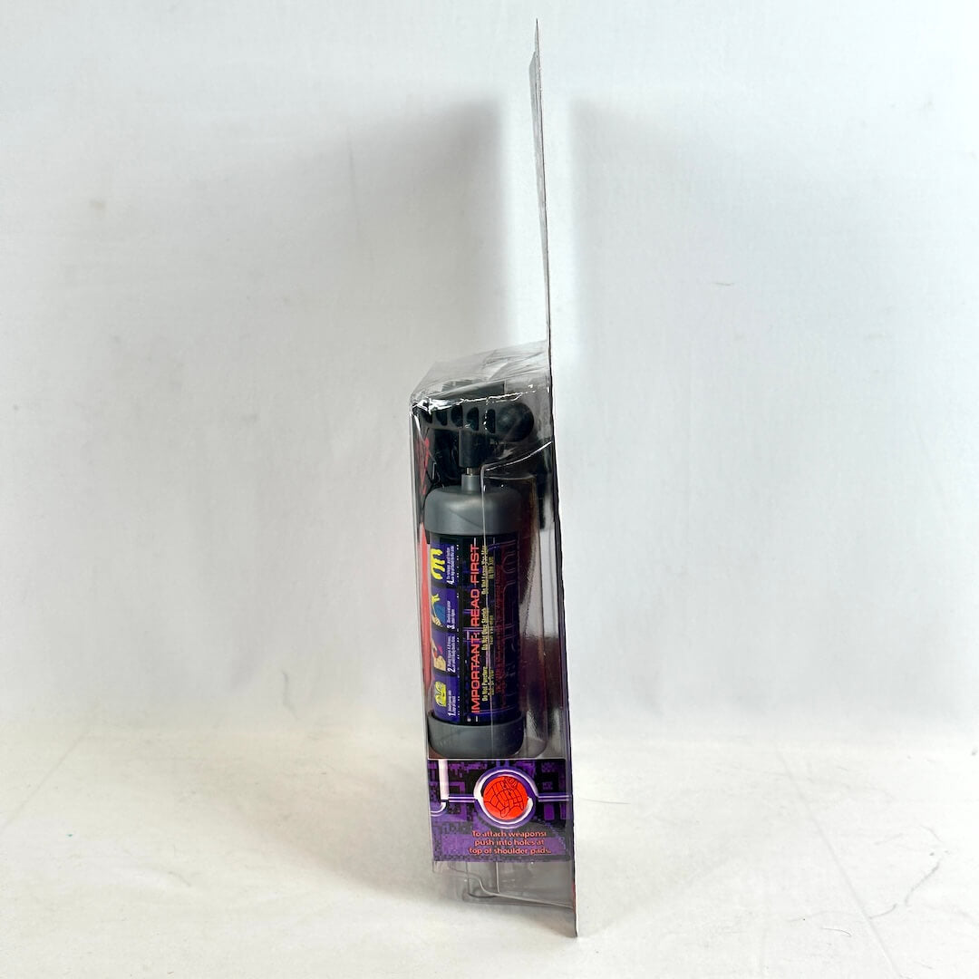 Side view of toy in packaging to show condition against white background. 