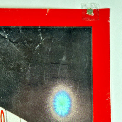 Upper right corner of poster showing some scratches, and small tear to border. 