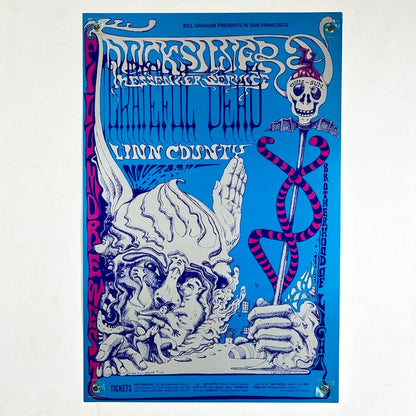 Vintage-style concert poster with intricate designs and text on a blue background