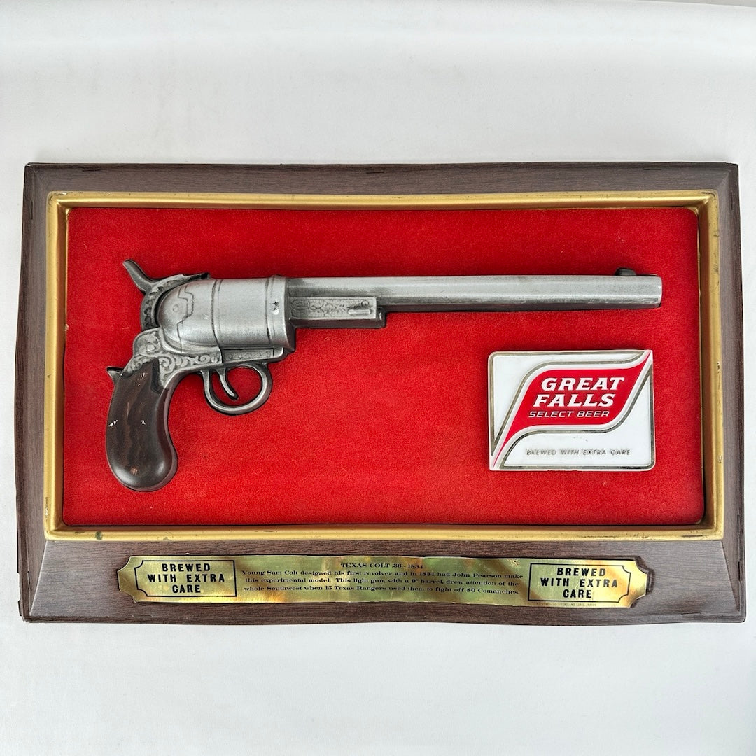 1960s plastic wall promotional sign for Great Falls Select Beer, featuring a Colt .36 pistol mounted at the center against a red felt background. The sign measures approximately 11.5 inches by 17.5 inches by 2.25 inches, showcasing a vintage collectible aesthetic.