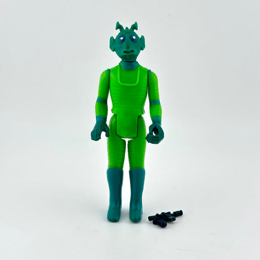 Green alien action figure with small black accessories on a white background