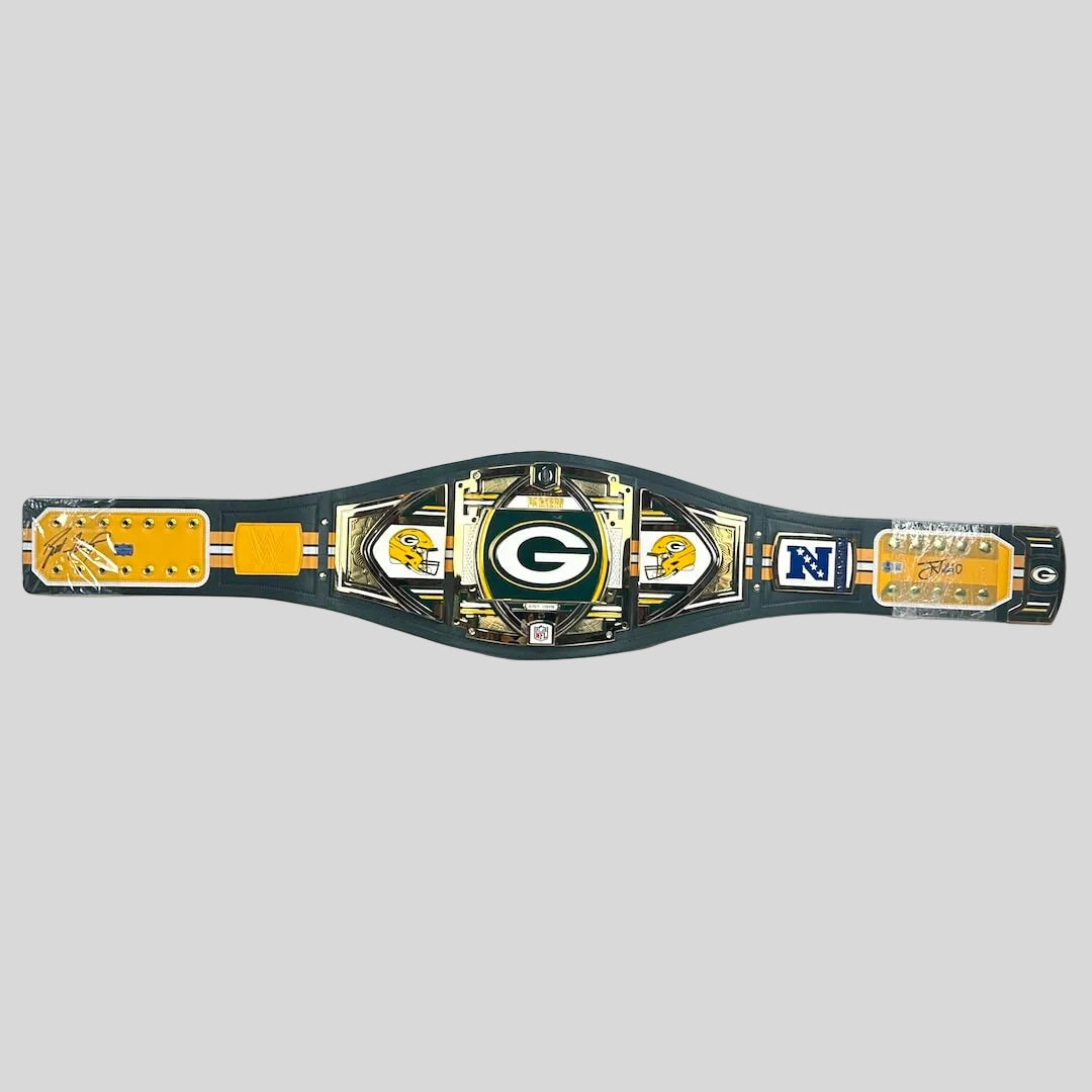 A Green Bay Packers replica championship belt displayed horizontally on a gray background. 