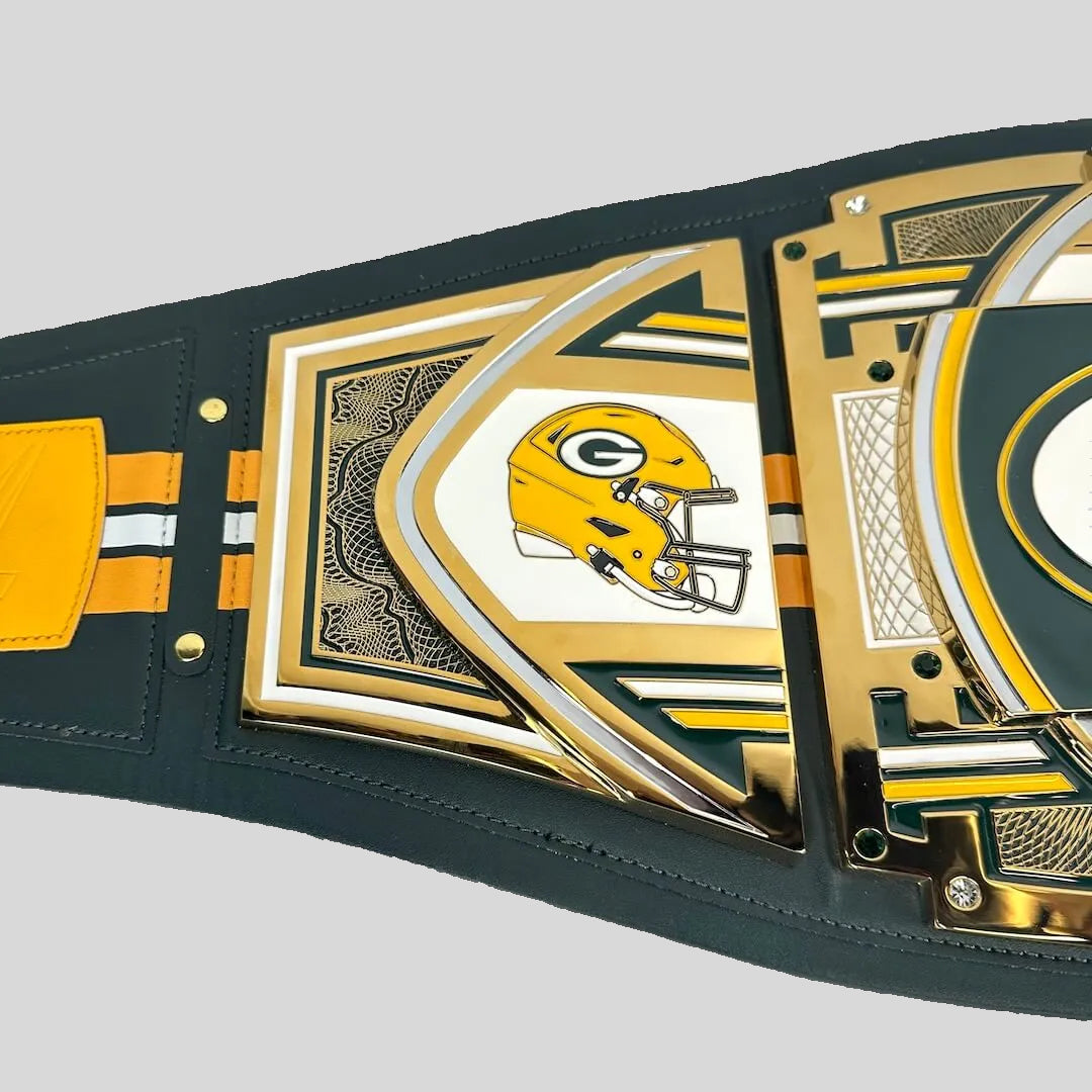 A Green Bay Packers themed belt featuring the team's yellow helmet logo, green and gold metallic accents, and a dark green strap, shown on a light gray background.