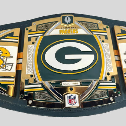 A Green Bay Packers NFL championship belt featuring a large central green and white 'G' logo, gold and green decorative plates, side panels with team graphics, and an NFL shield logo at the bottom.