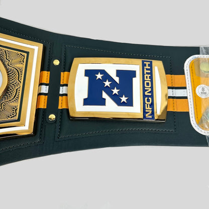 NFC North belt featuring a dark green leather strap with gold and orange accents, a large gold and blue 'N' logo with white stars, and 'NFC NORTH' text on the center plate.
