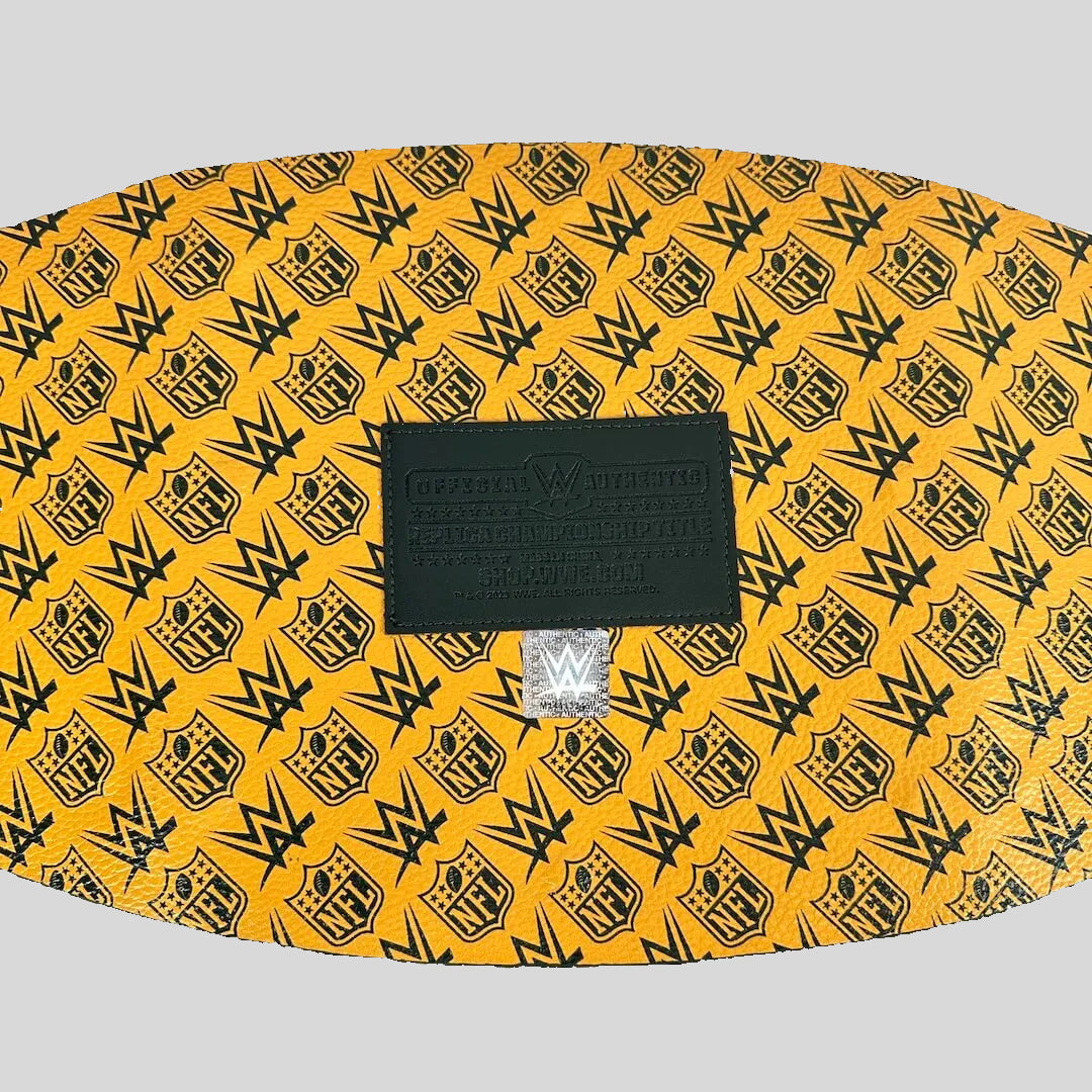 A yellow and black WWE-themed belt buckle featuring a repeating pattern of the WWE logo and NFL shield, with a black central brand plaque.
