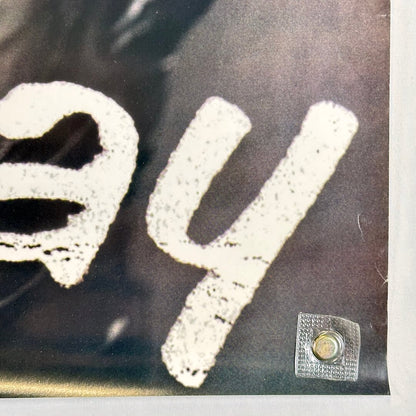 Bottom right corner of posters with minor crease above corner. 