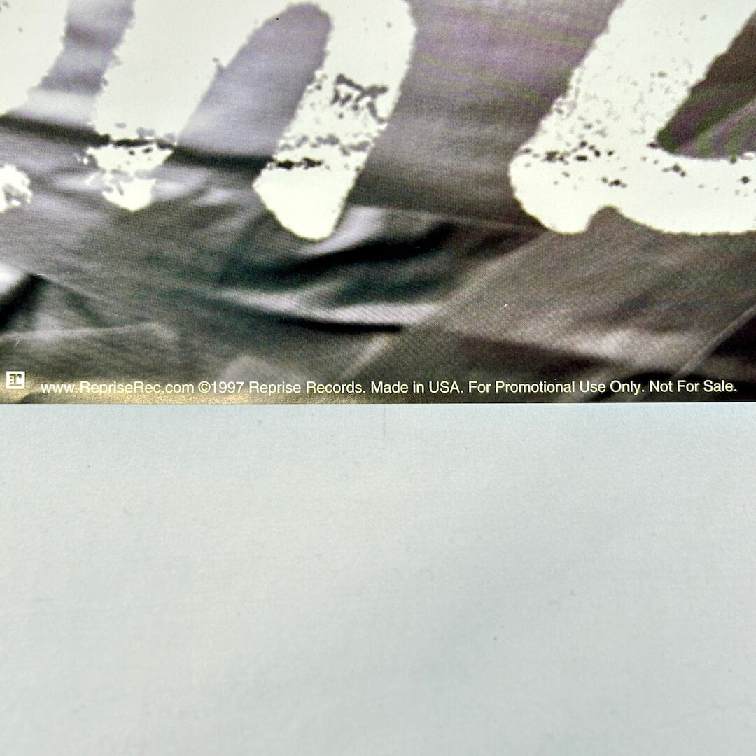 Bottom center of poster with promo information. 