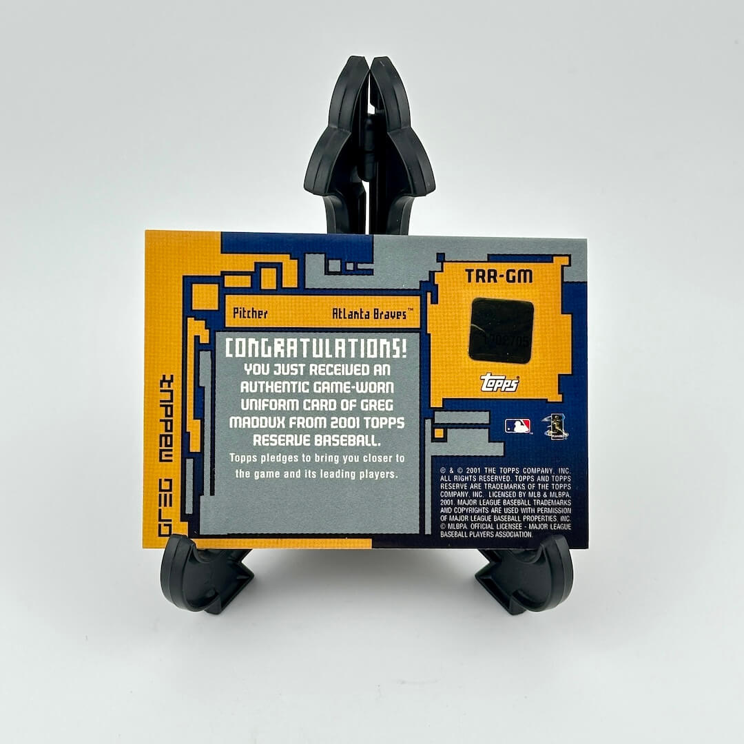 Baseball card holder with a card featuring text and graphics on a white background