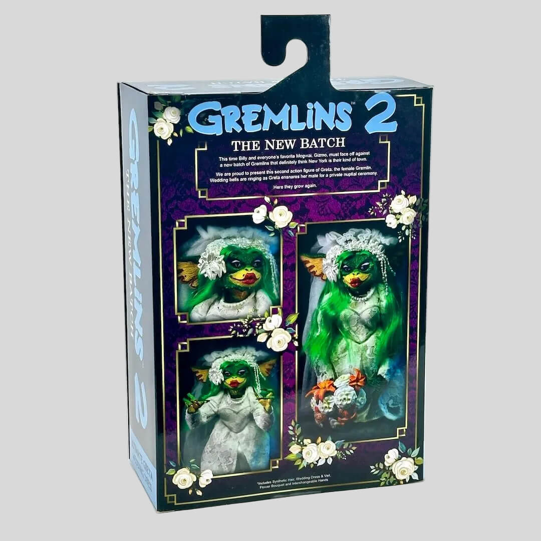 Gremlins 2 action figure packaging with green creature and flowers on a gray background