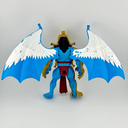 figure of winged creature with gold armor on white background. 
