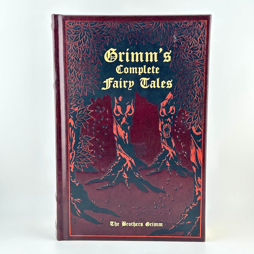 Book titled 'Grimm's Complete Fairy Tales' with decorative cover on a white background