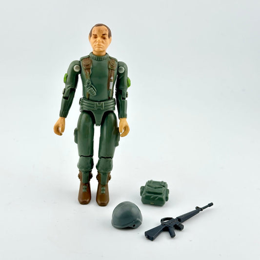 Toy figure in green military suit with accessories on a white background
