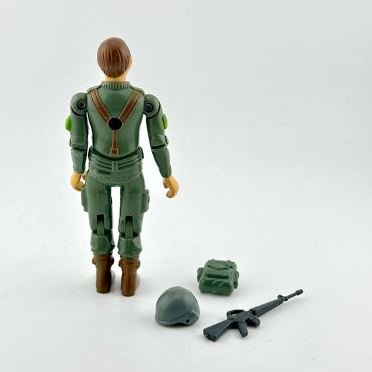 Toy figure in green military suit with accessories on a white background