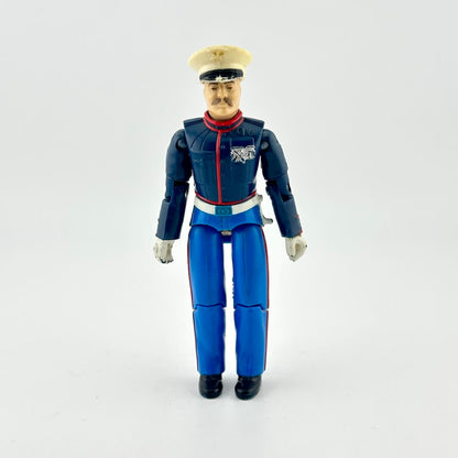 GI Joe action figure in military dress uniform, photographed on white background. 