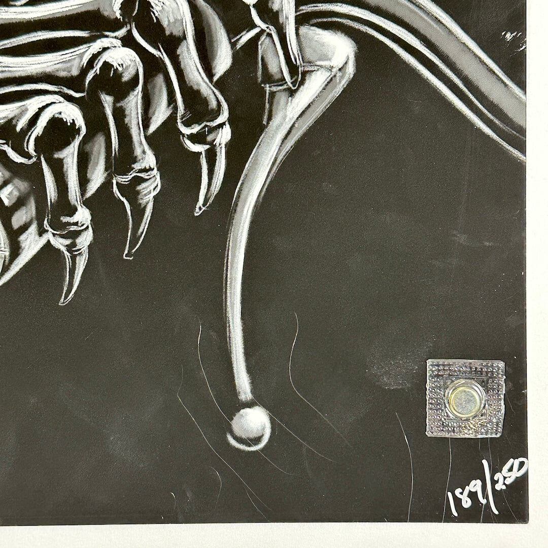 Bottom right corner of poster with poster number and scratches to surface. 