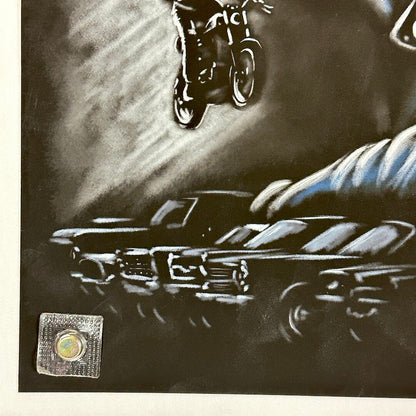 Bottom left corner of poster with some scuffs to black surface. 