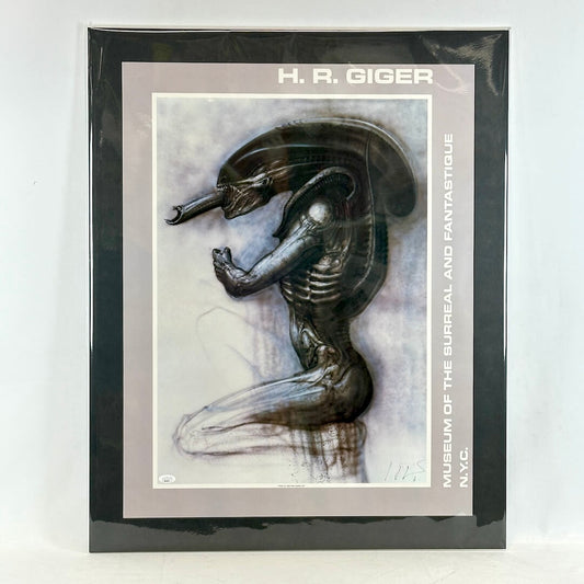 Matted artwork of a creature design by H.R. Giger with a black border and white background.